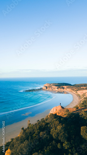 Aerial View of Beautiful Beach Coastline with Person on top of Cliffs Along the Great Ocean Road Australia