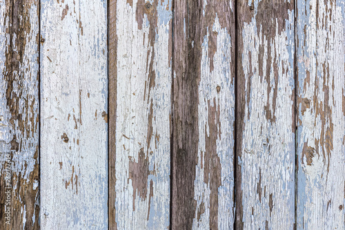 old wooden brown textured planks background with flaking paint