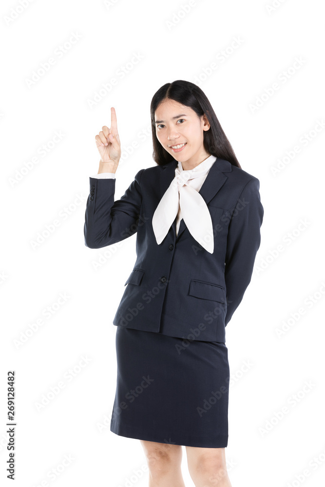Young Asian young girl thinking and pointing upwards while smiling . Young Asian young girl thinking and pointing upwards while smiling .