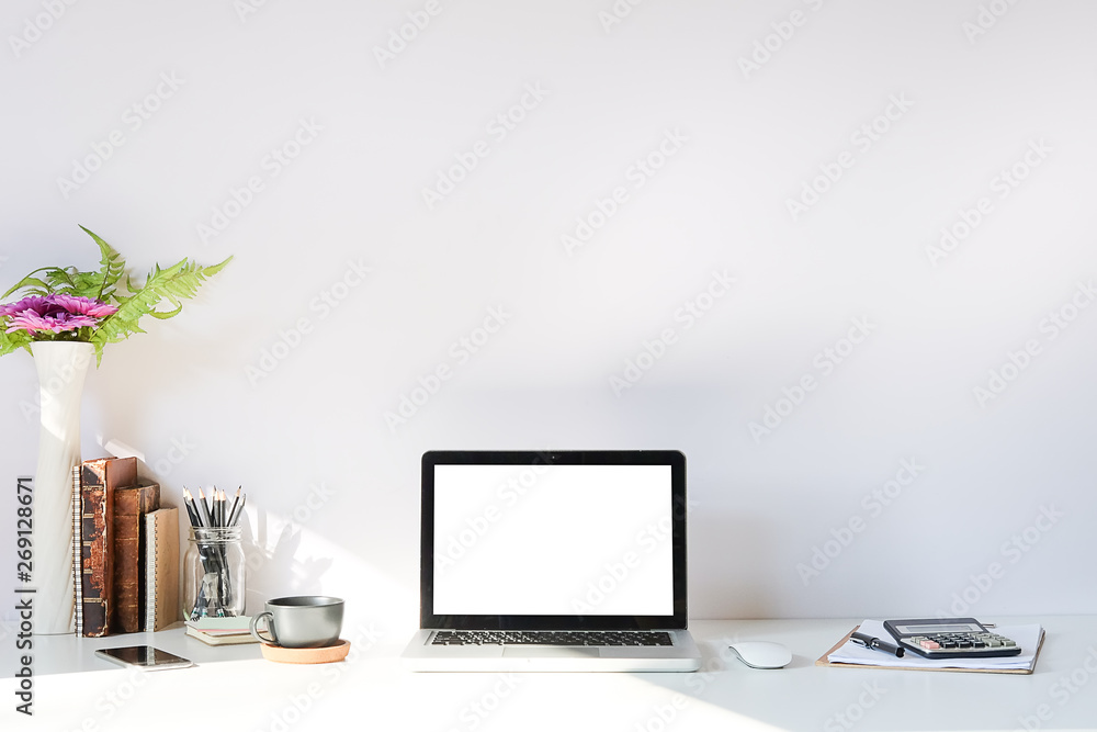 Fototapeta premium Workspace desk and laptop. copy space and blank screen. Business image, Blank screen laptop and supplies..
