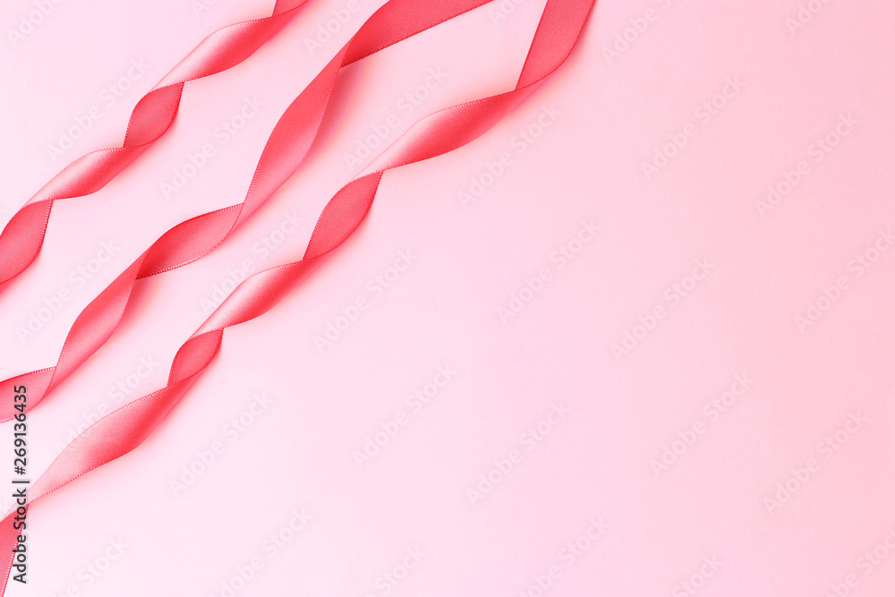 Three gift ribbons on a pink background, copy space Three gift ribbons on a pink background, copy space