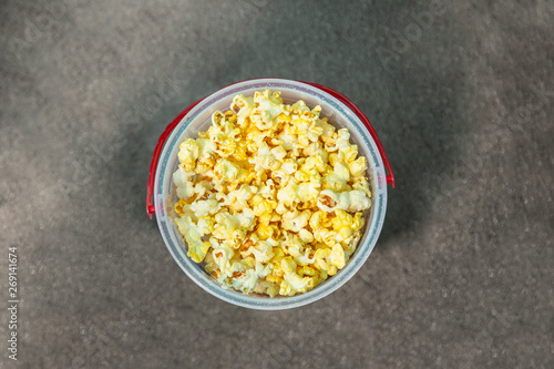 Delicious bucket of buttered popcorn viewed from above. Ready for a day or night of entertainment