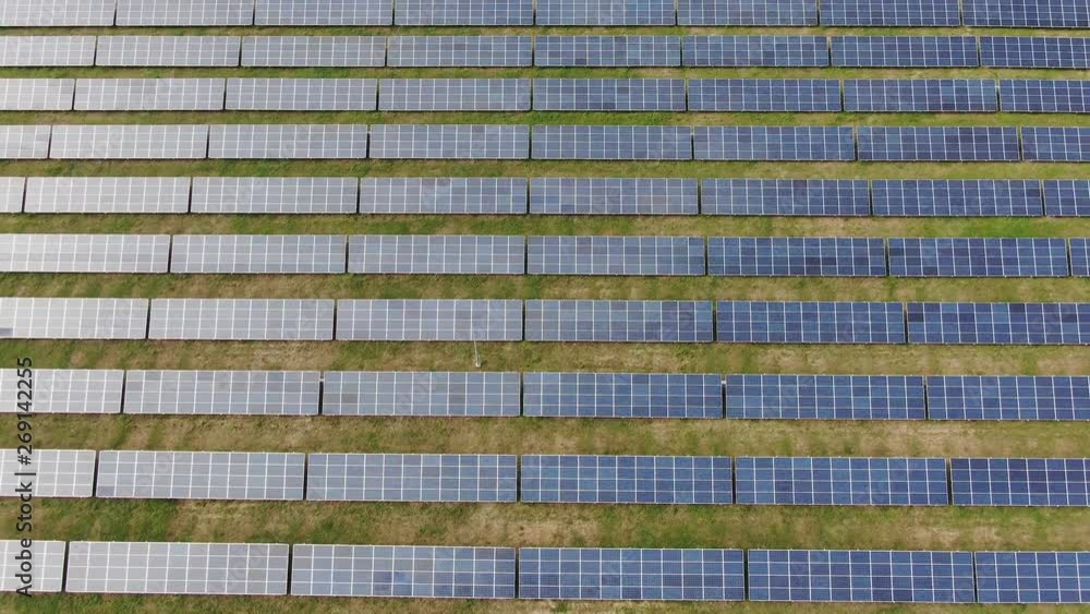 Flight over the solar power station rows panel Glide moving among the cells Flight over the solar power station rows panel Glide moving among the cells