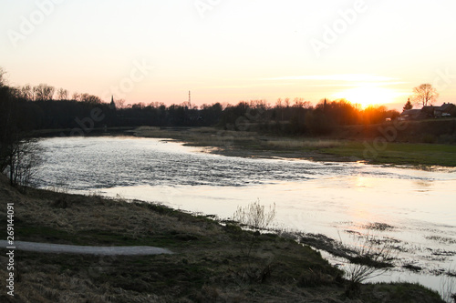 Beautiful countryside river view with amazing sunset in the background. 