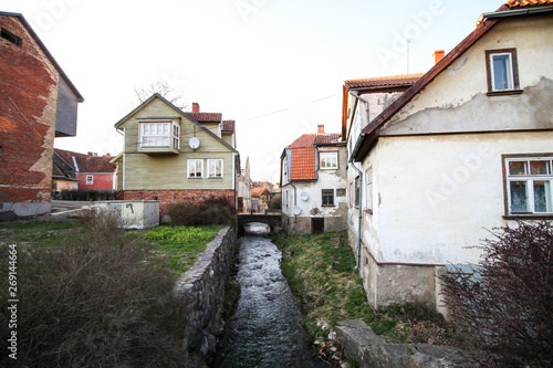 Beautiful view of old ancient river through old, small countryside city.