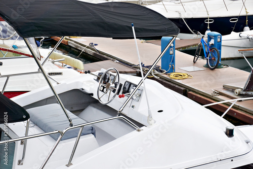 Steering wheel of sea boat in parking