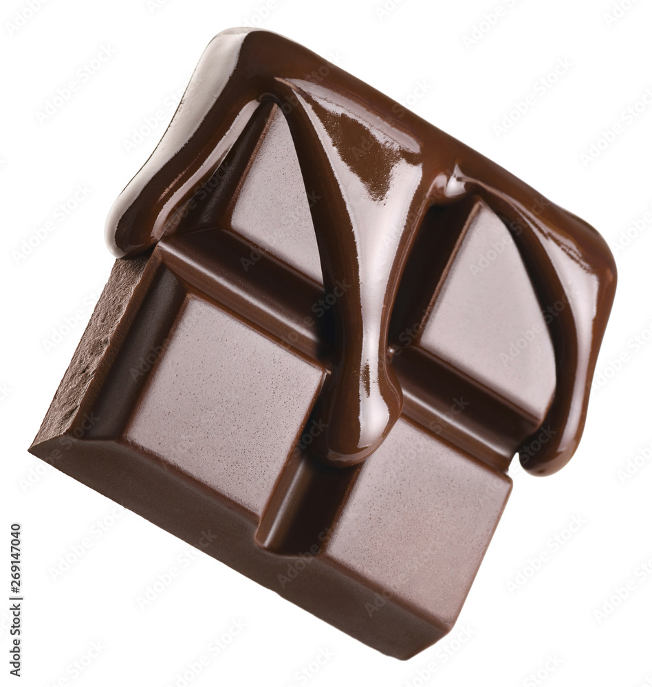 Melted chocolate pours into a piece of chocolate bar isolated on white