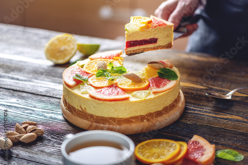 A piece of raw citrus cake with grapefruit  orange  lime and lemon. Cooking healthy summer vegan dessert