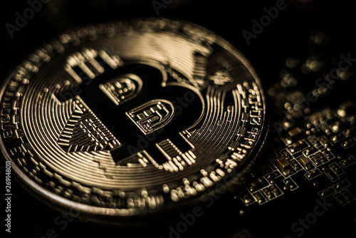 Close-up shot of copper bitcoin coin. Cryptocurrency virtual money concept