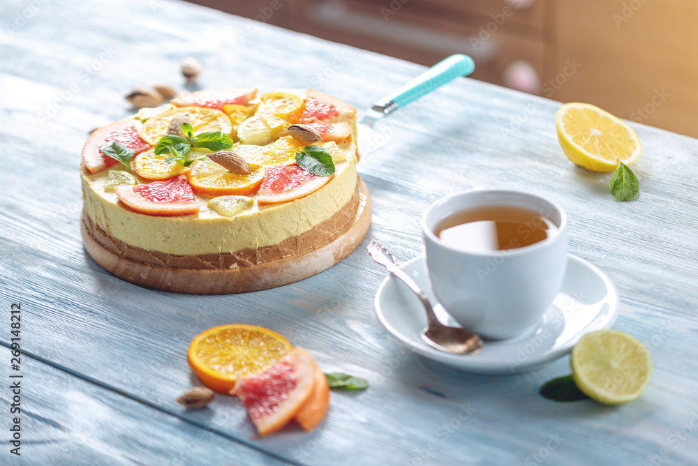 Raw citrus cake with grapefruit, orange, lime and lemon with nuts and mint. Fresh summer dessert. Gluten free vegan food Raw citrus cake with grapefruit, orange, lime and lemon with nuts and mint. Fresh summer dessert. Gluten free vegan food