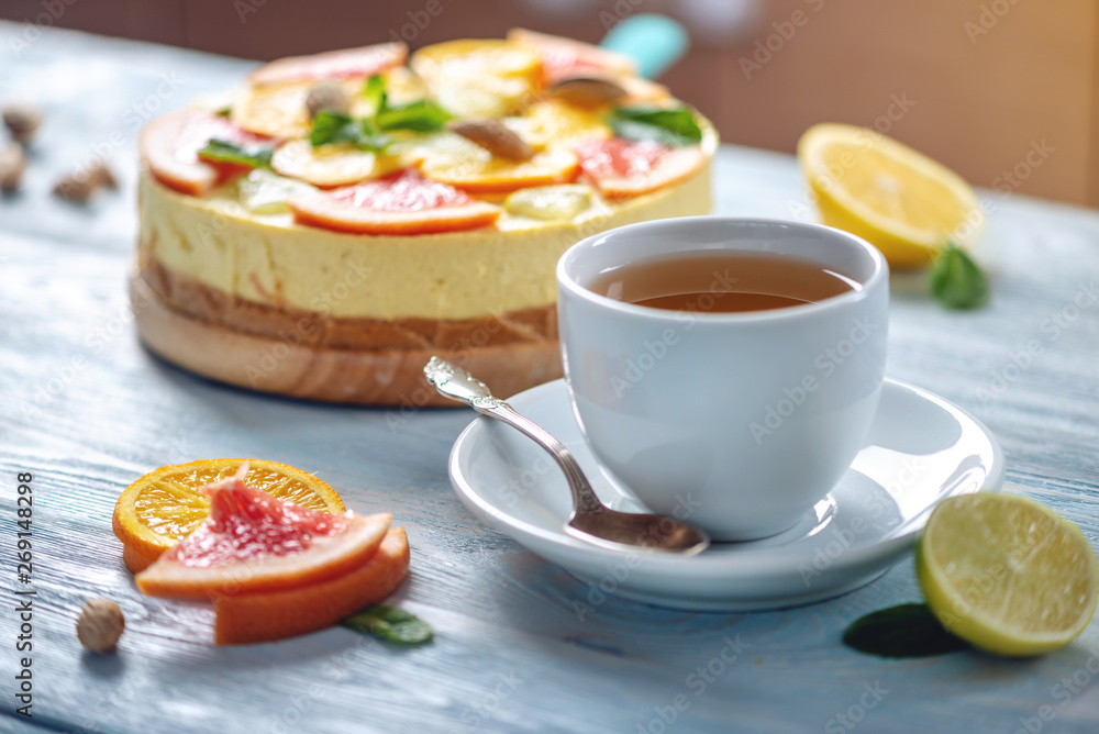 Raw citrus cake with grapefruit, orange, lime and lemon with nuts and mint. Fresh summer dessert. Gluten free vegan food Raw citrus cake with grapefruit, orange, lime and lemon with nuts and mint. Fresh summer dessert. Gluten free vegan food