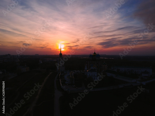 Ryazan Kremlin from a bird's-eye view at sunset. Temple with a Golden cross from a height.