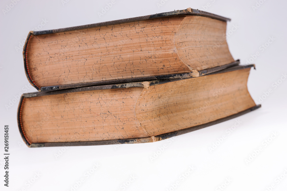 Fototapeta premium Two old books on white. Old publication. White isolated background