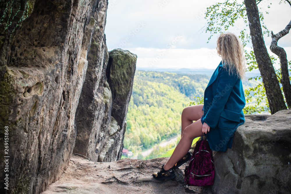 Naklejka premium Woman travelling to Rock Bridge Bastei and nature views - Saxon Switzerland, Germany 