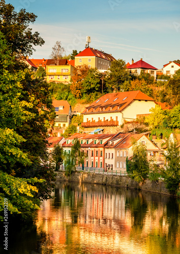 Evening sunlight senery of river and old buildings on the slope of the city Cesky Krunlov