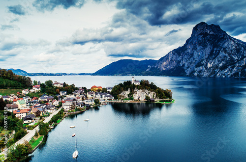 Aerial view of Austrian lake with beautuful mountain landscape and caslte on a hill