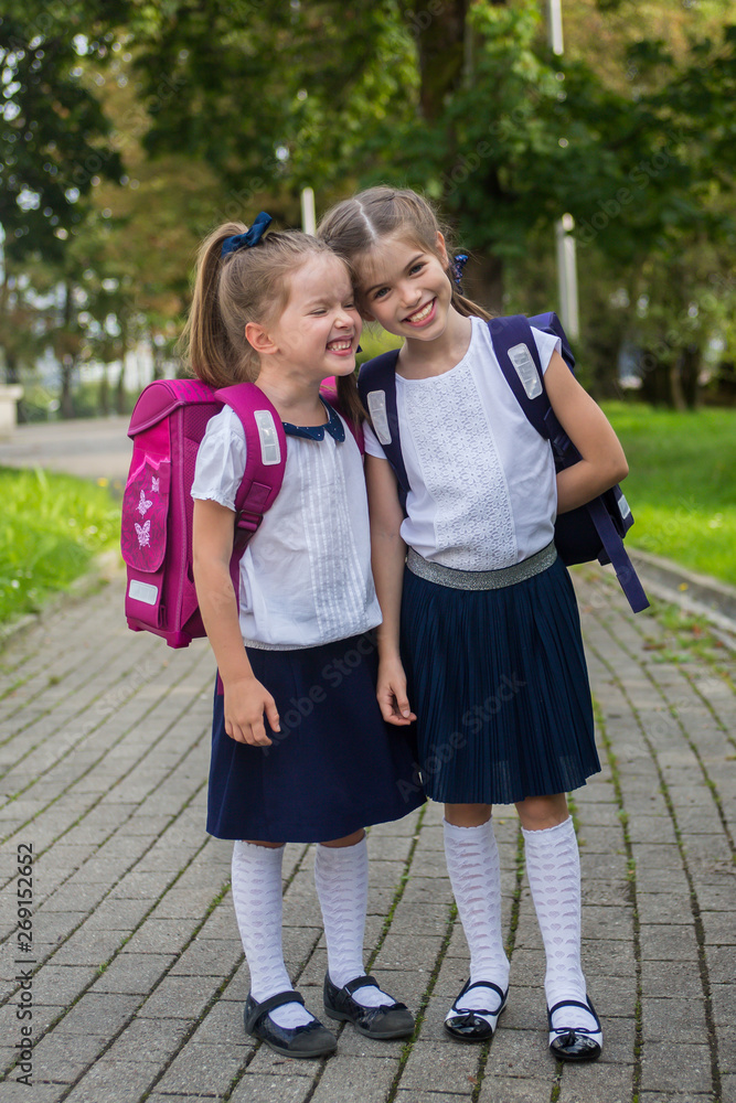 happy schoolchildren rejoice at the end of the school year, school holidays, school break. concept back to school and September 1 happy schoolchildren rejoice at the end of the school year, school holidays, school break. concept back to school and September 1
