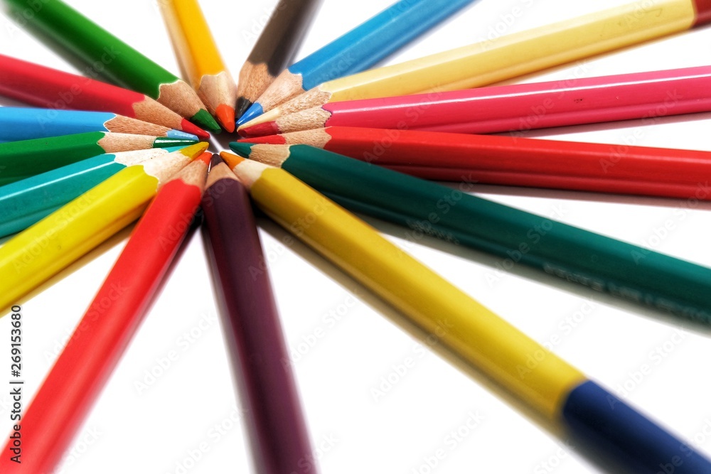 Creative color pencils wheel on white background