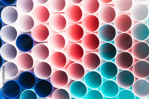 Abstract colorful background. Background from cocktail tubes close up. Soft focus. Cocktail tubes of different colors close up.Close-up of straw tubes.