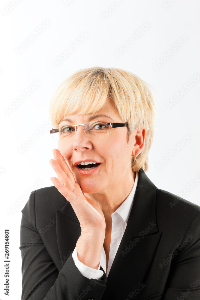 Happy mature businesswoman saying secret Happy mature businesswoman saying secret