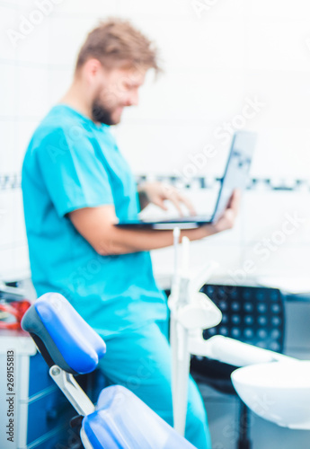 Doctor working on laptop at the working place