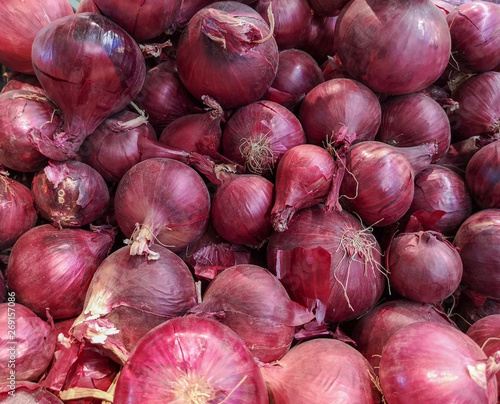 Red onions on the counter in the store