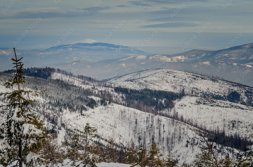 Beautiful winter mountain landscape. Magical snow-covered slopes in the Polish mountains.