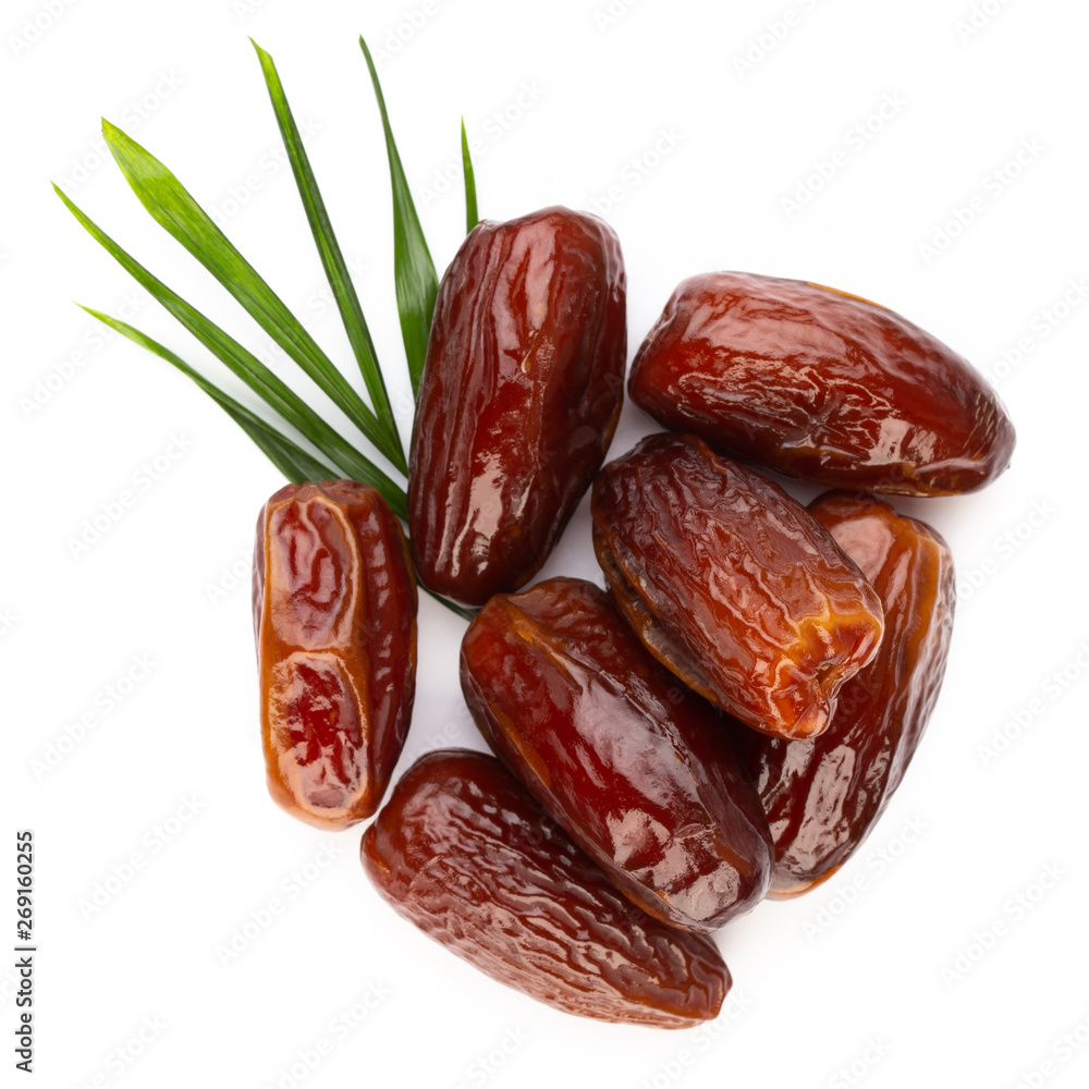 Dry dates isolated on white background. Top view. Flat lay pattern. Dry dates isolated on white background. Top view. Flat lay pattern.