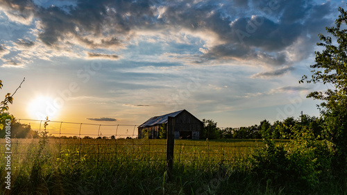 Scenic rural countryside with old barn in a field