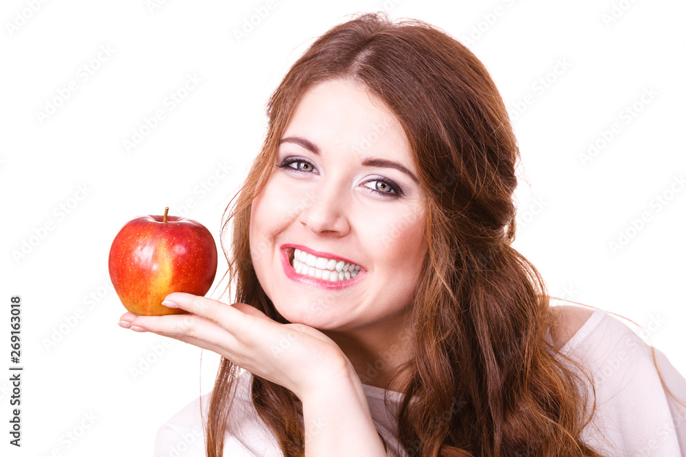 Woman holds apple fruit close to face, isolated Woman holds apple fruit close to face, isolated