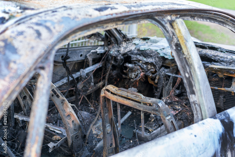 burnt down gray passenger car