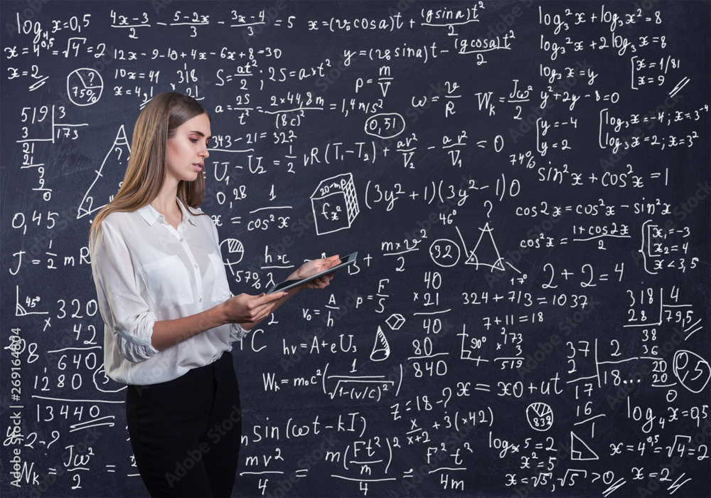 Beautiful woman thinking how to solve a math problem Beautiful woman thinking how to solve a math problem