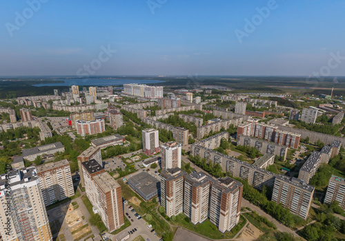 Top down aerial drone image of a Ekaterinburg city in the end of spring, backyard turf grass and trees lush green