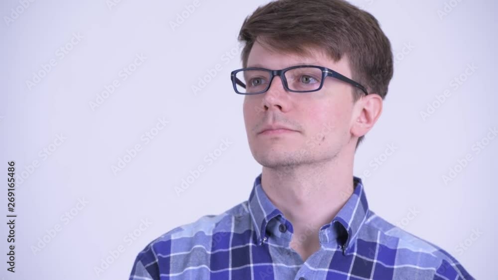 Face of happy young handsome hipster man thinking Face of happy young handsome hipster man thinking