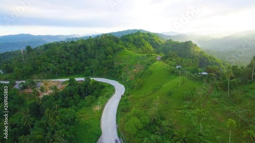 drone shots with greeny trees and surrounding mountains