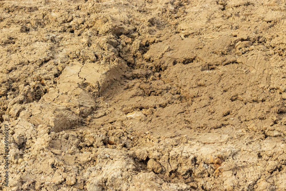 Ground dirt soil soil sand clay alumina texture background close-up Ground dirt soil soil sand clay alumina texture background close-up