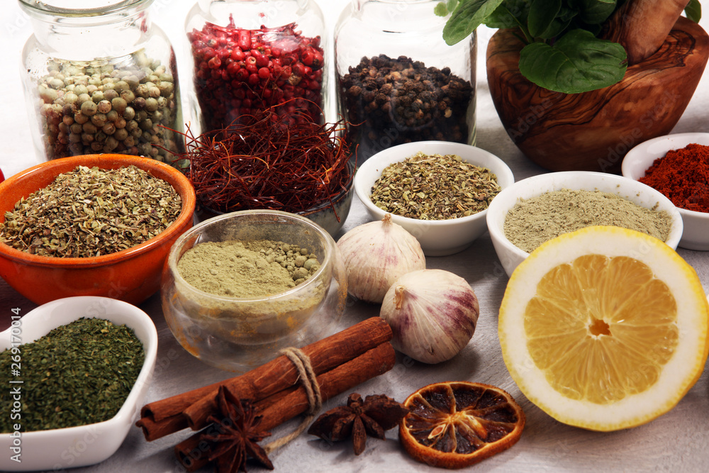 Spices and herbs on table. Food and cuisine ingredients with basil Spices and herbs on table. Food and cuisine ingredients with basil