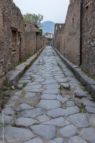 Pompeii, Italy. 04-22-2019. Paved street at antique roman city of Pompeii, Italy.