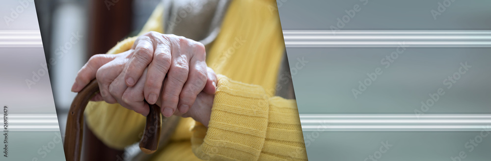 Old woman hands holding a cane. panoramic banner Old woman hands holding a cane. panoramic banner