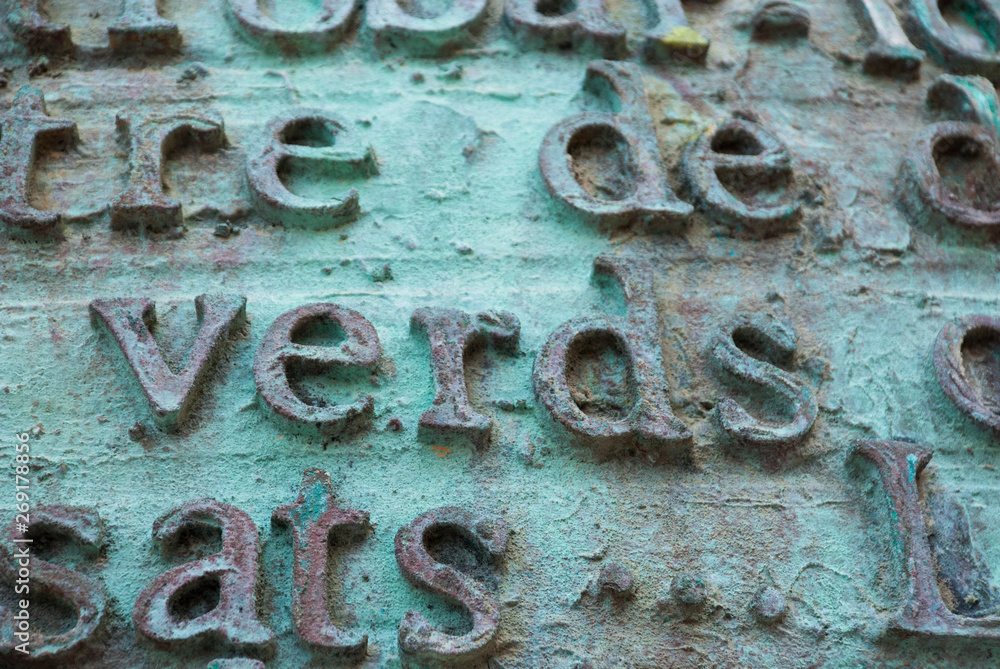 Metal letters and words in spanish and english. Text background vintage. Metal letters and words in spanish and english. Text background vintage.