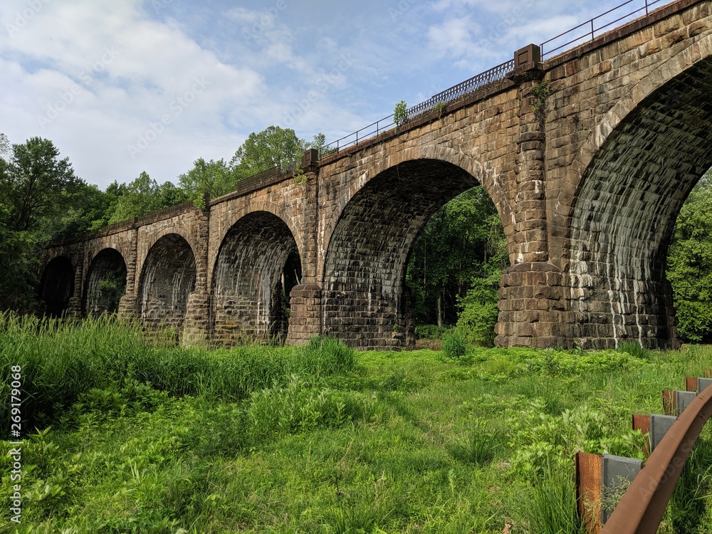 Green Pasture with Arched Bridge and Rusted Guard Rail (Viaduct) Green Pasture with Arched Bridge and Rusted Guard Rail (Viaduct)