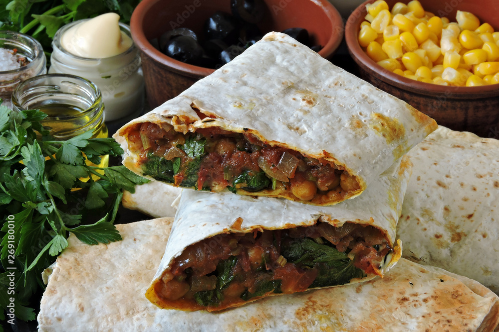 Vegan burritos. Healthy lunch or snack. Useful fast food. Stock Photo
