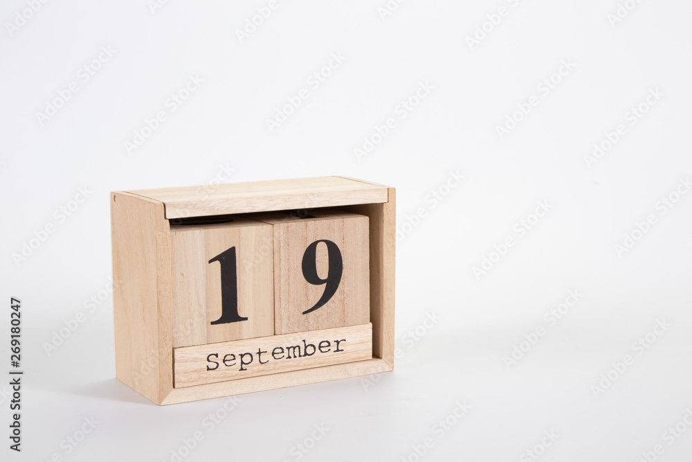 Wooden calendar September 19 on a white background Wooden calendar September 19 on a white background