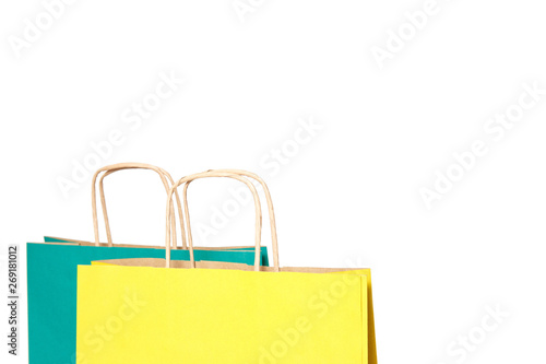 Yellow and green paper shopping bags isolated