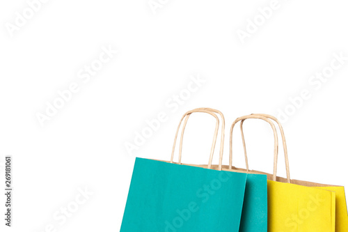 Yellow and green paper shopping bags isolated
