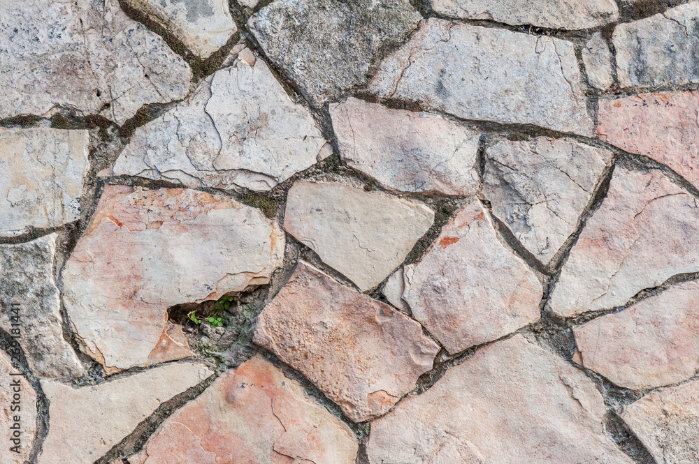 Obraz premium abstract background of pink and gray stone wall close up