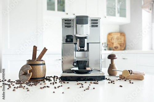 Obraz na płótnie Still life with homemade coffee machine on the kitchen table with wooden container with coffee beans