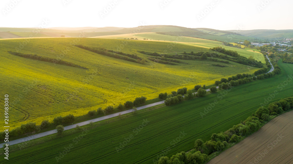 Beautiful aerial landscape in Moravia, Czech Republic. Sunrise over rolling hills in Moravia, aerial drone view. 