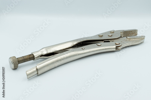 This capture of a silver socket wrench on a white background and in a studio light 