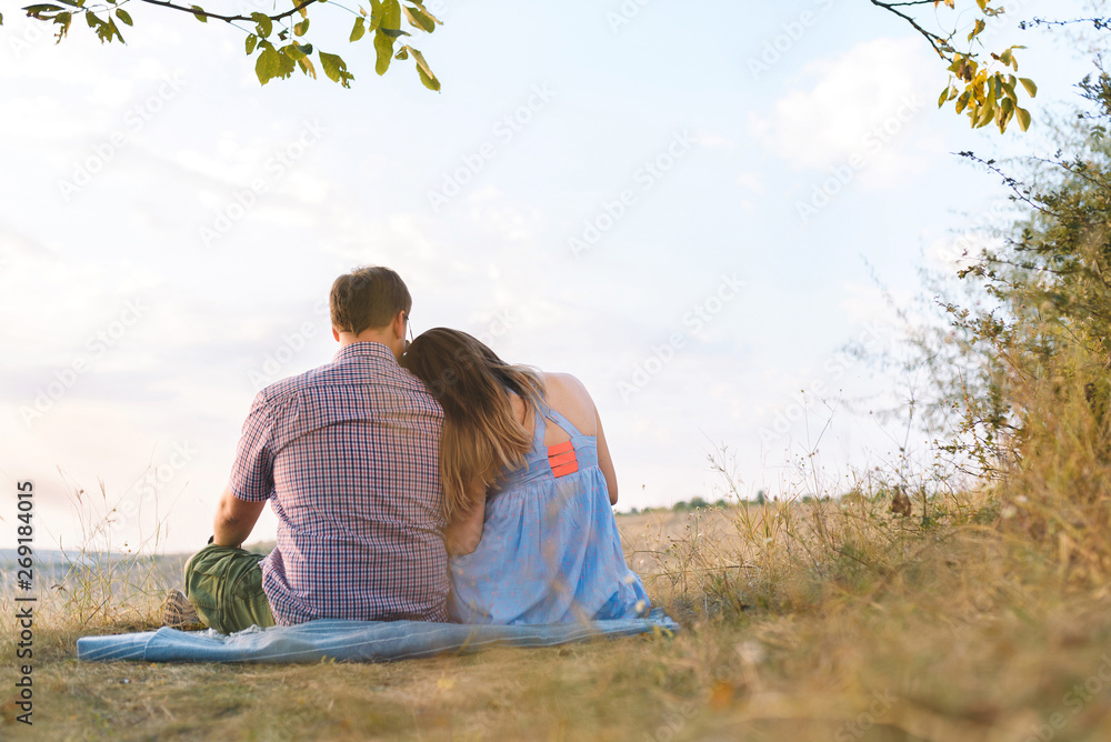 couple sitting on grass